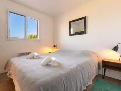 a bedroom with a bed with two towels on it at Holiday Home Verde by Interhome in Porto-Vecchio