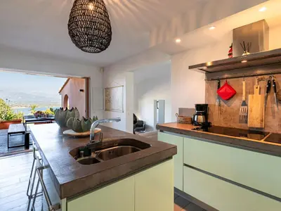 a kitchen with a sink and a counter at Holiday Home Verde by Interhome in Porto-Vecchio