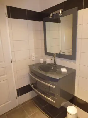 a bathroom with a sink and a mirror at Accommodation Close To Pinarello Beach in Conca