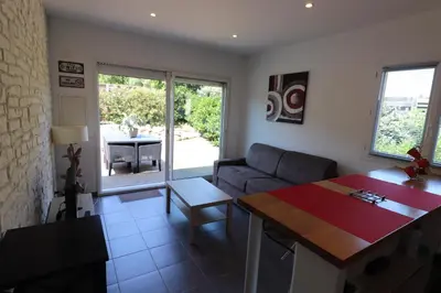a living room with a couch and a table at Accommodation Close To Pinarello Beach in Conca