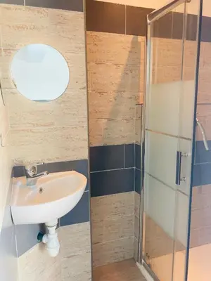 a bathroom with a sink and a glass shower at Casa Serena in Linguizzetta