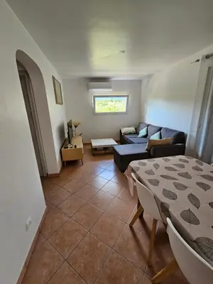 a living room with a couch and a table at Casa Marcelli 4 in Porto-Vecchio