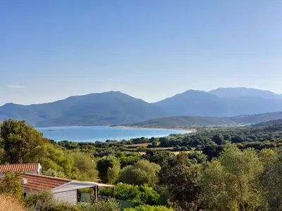 a view of a lake with mountains in the background at Mira Monti Location in Belvédère