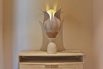 a vase sitting on top of a wooden table at Lodge La Myrte Di Lecci in Lecci