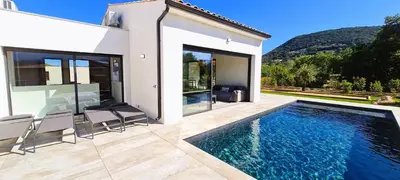 a villa with a swimming pool and a house at Villa Florida, 8 pers, vue montagne, 350 m plage à pieds in Pinarellu