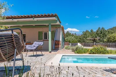 a pool in front of a house with a patio at Casetta Taglio Rosso Di Santa Lucia in Sainte-Lucie de Porto-Vecchio