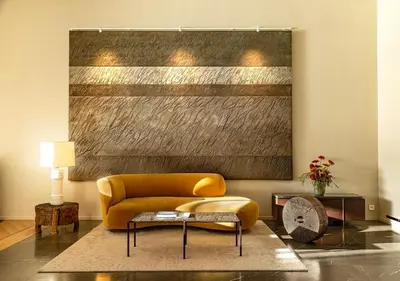 a living room with a yellow couch and a table at Casadelmar in Porto-Vecchio