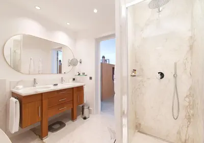 a bathroom with a shower and a sink and a mirror at Casadelmar in Porto-Vecchio
