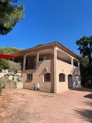 a large house with a yard in front of it at Appartement meublé Porto vecchio in Porto-Vecchio