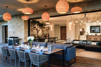 a dining room with a long table and chairs at A Liccia in Pianottoli-Caldarello