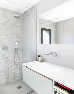 a bathroom with a white sink and a mirror at A Liccia in Pianottoli-Caldarello