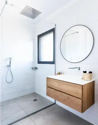 a bathroom with a sink and a mirror at A Liccia in Pianottoli-Caldarello