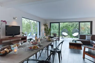 a living room with a table with food on it at Casa Julia in Zonza