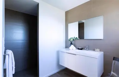 a bathroom with a white sink and a mirror at Villa Supranu in Viggianello