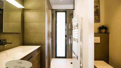 a bathroom with a sink and a bath tub at Villa U Scopu, 6 pers, piscine chauffée, 10 mn plage en voiture in Lecci