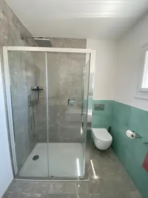 a bathroom with a shower and a toilet at Fiore di Machja - Moncale in Moncale