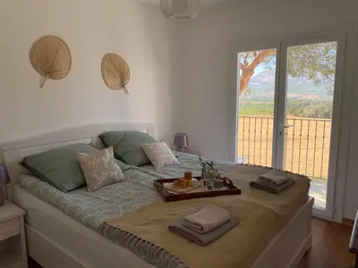 a bedroom with a bed with a tray of food on it at Fiore di Machja - Moncale in Moncale