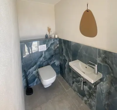 a bathroom with a sink and a toilet at Fiore di Machja - Moncale in Moncale