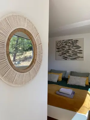 a mirror on a wall in a room with a bed at Fiore di Machja - Moncale in Moncale