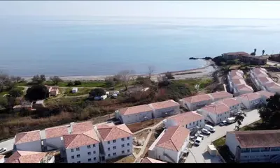 an aerial view of a village by the water at Residence Marina di Bravone in Linguizzetta