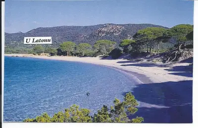 a beach with a sign that reads u zealotin at Résidence U LATONU in Porto-Vecchio