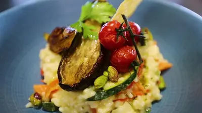 a blue plate of food with vegetables on it at Vignale Resort in Ghisonaccia
