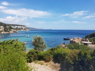 a view of a body of water with boats in it at Appartement RDJ ds villa vue mer panoramique in Lecci