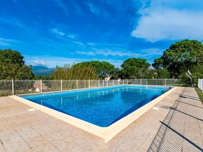 a swimming pool in a backyard with a fence at Apartment Casetta Bianca by Interhome in Porto-Vecchio