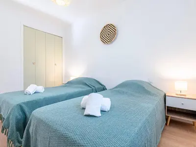 two beds in a bedroom with towels on them at Holiday Home Turriccioli by Interhome in Porto-Vecchio