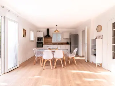 a kitchen and dining room with a table and chairs at Holiday Home Turriccioli by Interhome in Porto-Vecchio