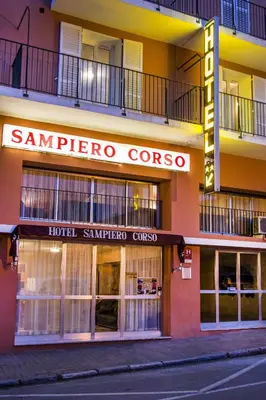 a building with a sambro crore crore sign on it at Hôtel Sampiero Corso in Corte