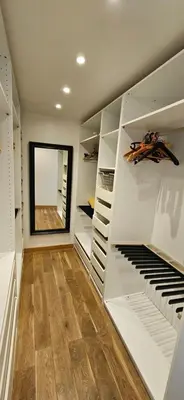 a walk in closet with white cabinets and a organ at Villa de standing Les Amandiers, vue mer & piscine in Propriano