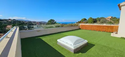 a mattress on the roof of a house at Villa de standing Les Amandiers, vue mer & piscine in Propriano