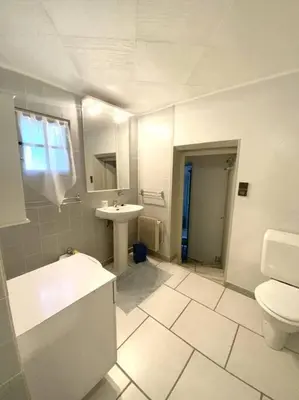 a bathroom with a toilet and a sink at Appartement en rez de villa in Aregno