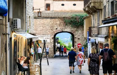 a group of people walking down a street at Villa Baccarat in Porto-Vecchio