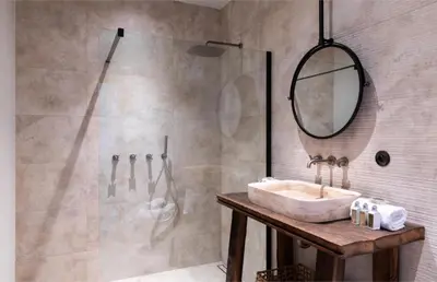 a bathroom with a sink and a shower at Villa Occhinello in Propriano
