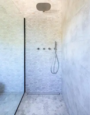 a bathroom with a shower with a shower head at Villa Occhinello in Propriano