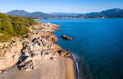 an aerial view of a beach and the ocean at Villa Occhinello in Propriano