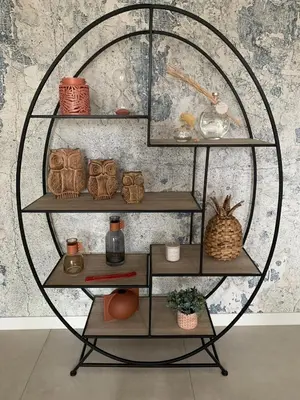 a shelf with various items on it in a room at Superb flat with a lovely view of the mountains in Porto-Vecchio