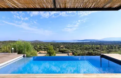 a swimming pool with a view from a house at Villa Nepita in Lecci