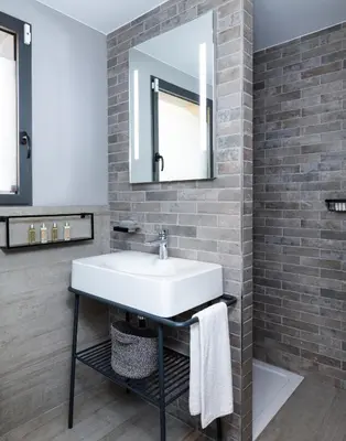 a bathroom with a sink and a mirror at Villa Nepita in Lecci