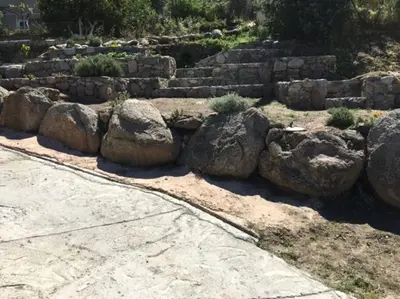 a bunch of rocks in a garden at SEJOUR DETENTE BALAGNE ENTRE MER ET MONTAGNE in Urtaca