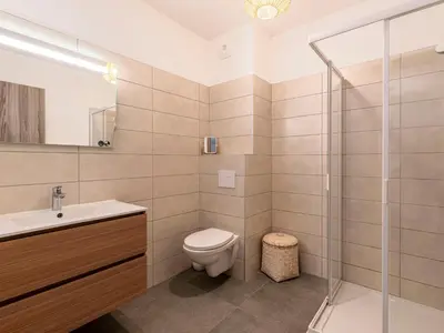 a bathroom with a toilet sink and a shower at Apartment St Joseph-2 by Interhome in Porto-Vecchio