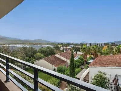 a view of a city from a balcony at Apartment St Joseph-2 by Interhome in Porto-Vecchio