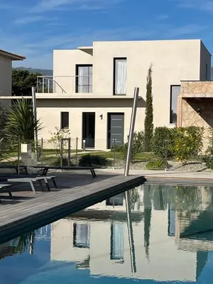 a house with a swimming pool in front of a house at Villa U Sanda in Lecci