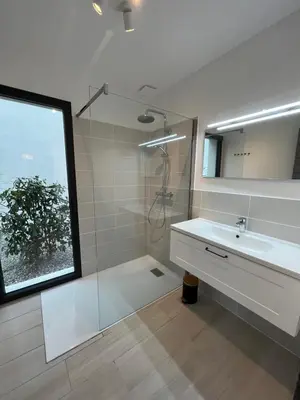 a bathroom with a sink and a shower and a mirror at Villa U Sanda in Lecci