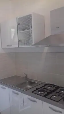 a kitchen with a sink and a stove at Studio à la campagne in Villanova