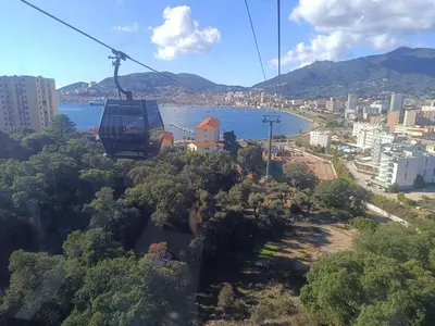 a gondola ride in the sky over a city at chambre d'hôte cosy L'AGHJA in Carbuccia