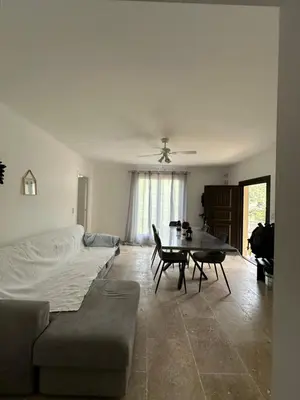 a living room with a couch and a table at casa in Palasca