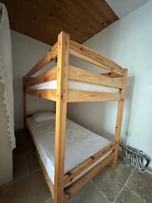 a set of bunk beds in a room at casa in Palasca